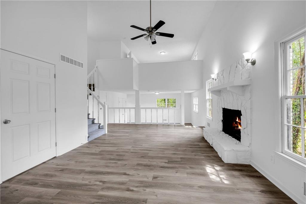 1586 Kings Road Marietta, GA 30062 - Photo 24 of 66 a view of an empty room with a fireplace and a window