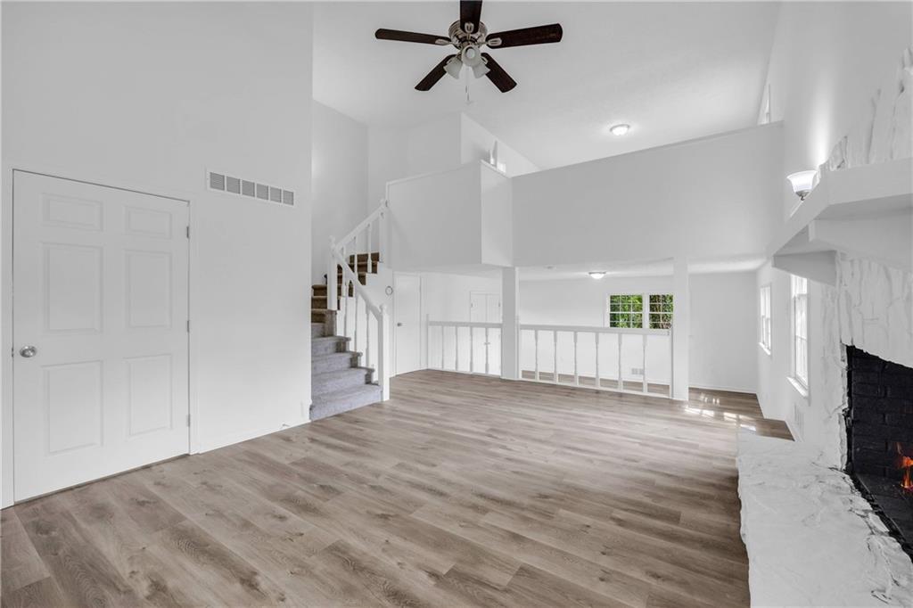1586 Kings Road Marietta, GA 30062 - Photo 25 of 66 a view of empty room with wooden floor and fan