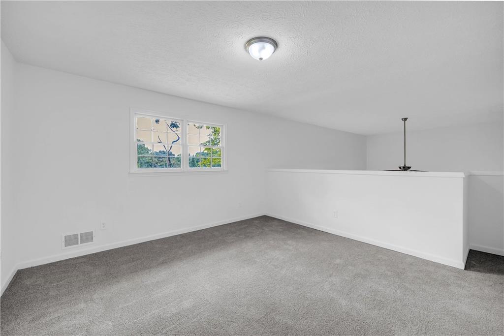 1586 Kings Road Marietta, GA 30062 - Photo 35 of 66 a view of an empty room with a window
