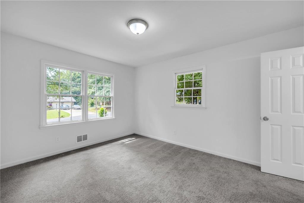 1586 Kings Road Marietta, GA 30062 - Photo 49 of 66 an empty room with windows