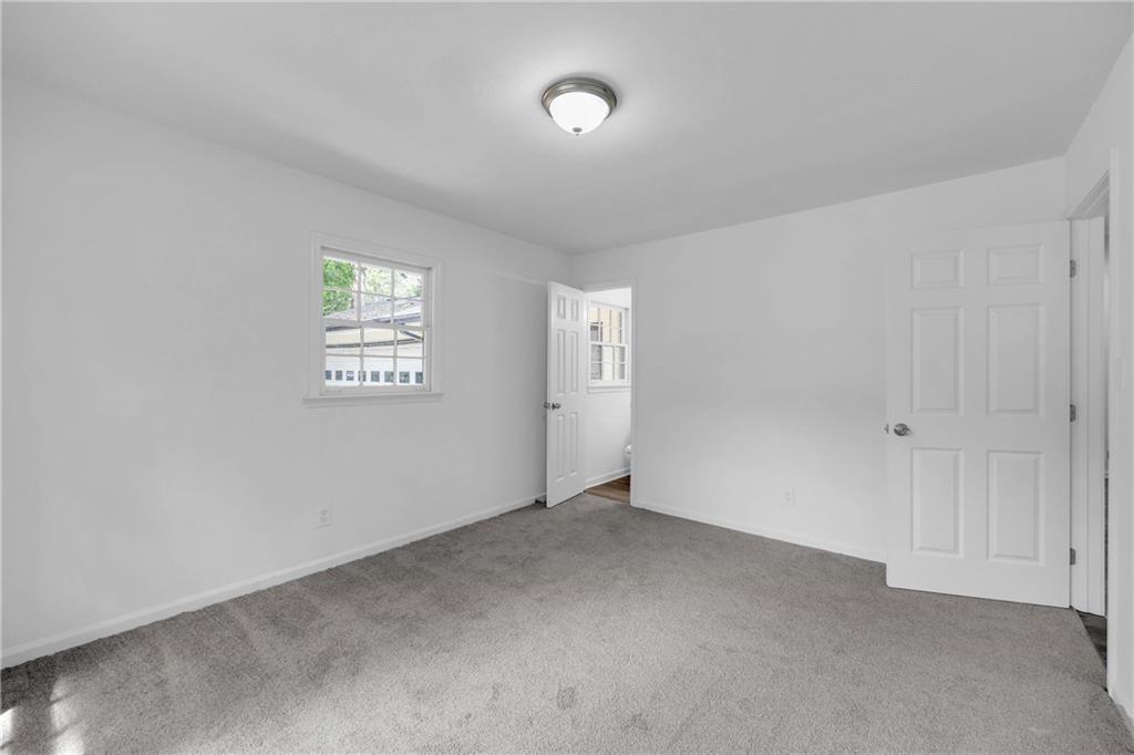 1586 Kings Road Marietta, GA 30062 - Photo 51 of 66 a view of an empty room with a window
