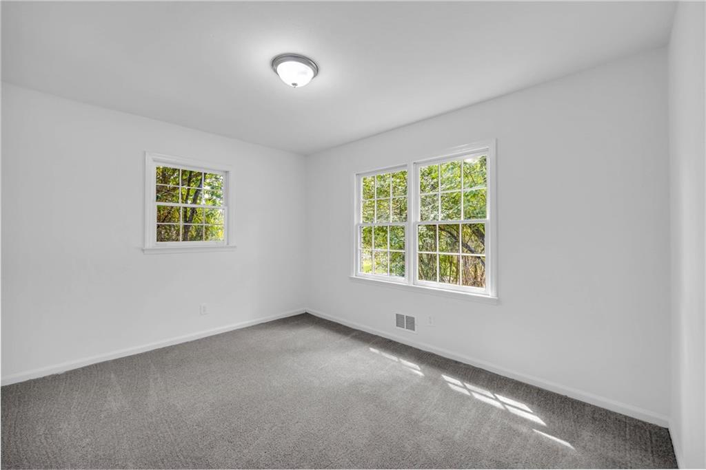 1586 Kings Road Marietta, GA 30062 - Photo 55 of 66 an empty room with a window
