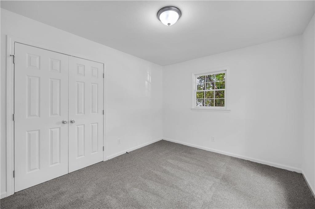 1586 Kings Road Marietta, GA 30062 - Photo 56 of 66 an empty room with a window
