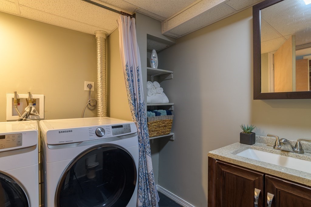 73 Sawmill Road Springfield, MA 01118 - Photo 22 of 30 a utility room with dryer and washer