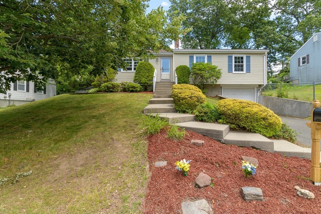 73 Sawmill Road Springfield, MA 01118 - Photo 30 of 30 a front view of a house with a yard and garage