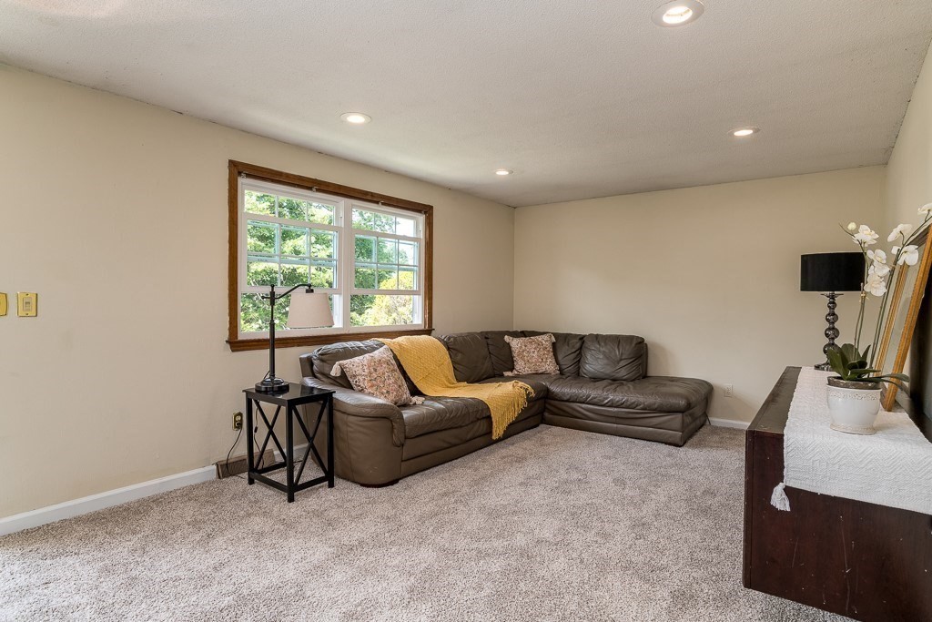73 Sawmill Road Springfield, MA 01118 - Photo 3 of 30 a living room with furniture and a flat screen tv