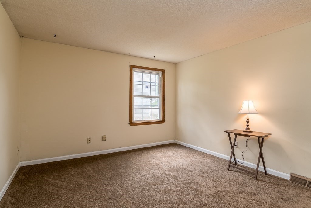 73 Sawmill Road Springfield, MA 01118 - Photo 10 of 30 an empty room with a window
