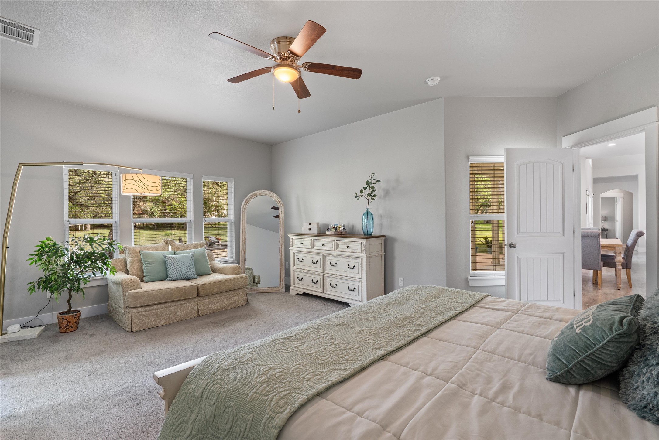 13105 Rooster Springs Road Austin, TX 78737 - Photo 11 of 38 This bedroom features vaulted ceilings, a ceiling fan, and carpeted floors