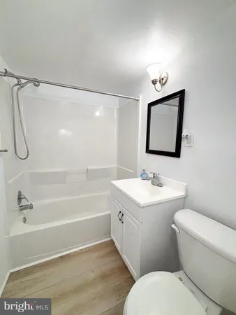 a bathroom with a toilet a sink and a bathtub