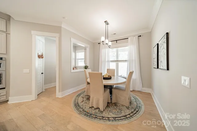 a view of a livingroom with furniture window and wooden floor