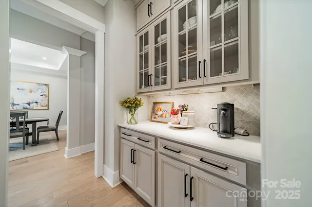 a kitchen with stainless steel appliances granite countertop a sink and cabinets