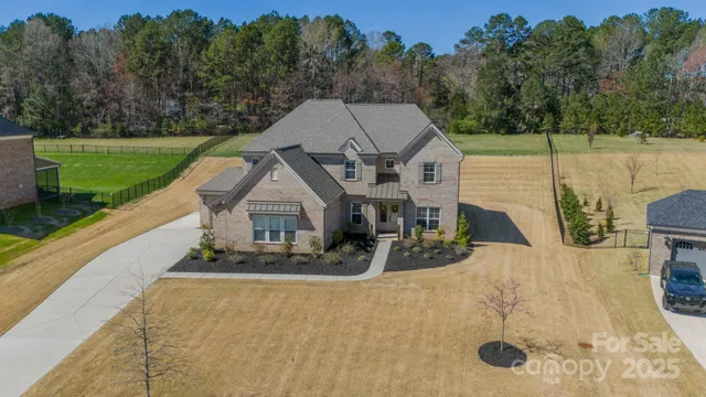 an aerial view of a house with porch