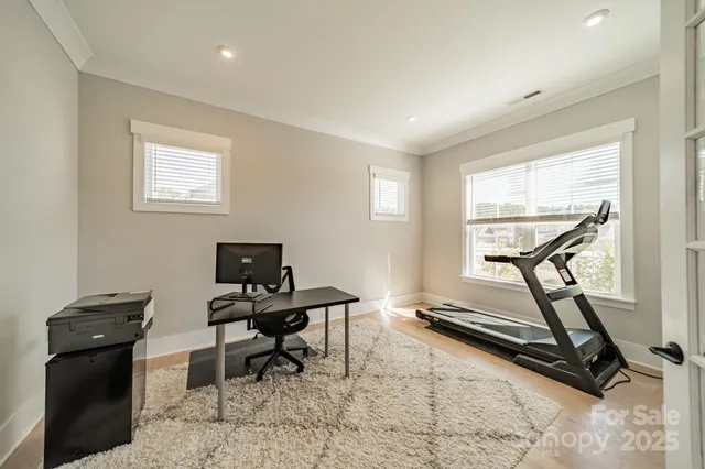 a view of a workspace with furniture