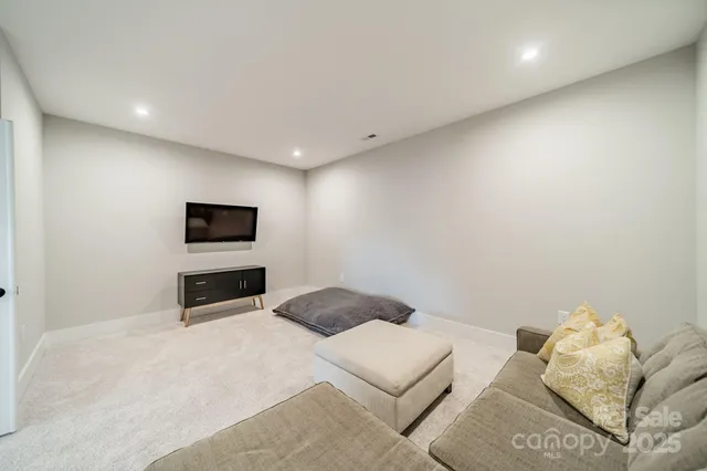 a bedroom with a bed and a tv