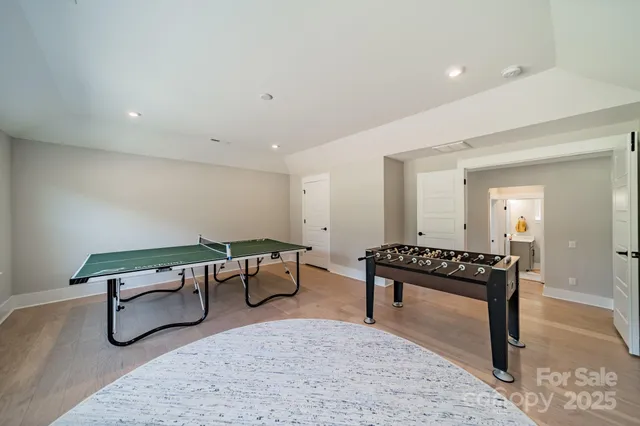 a living room with furniture a rug and a table