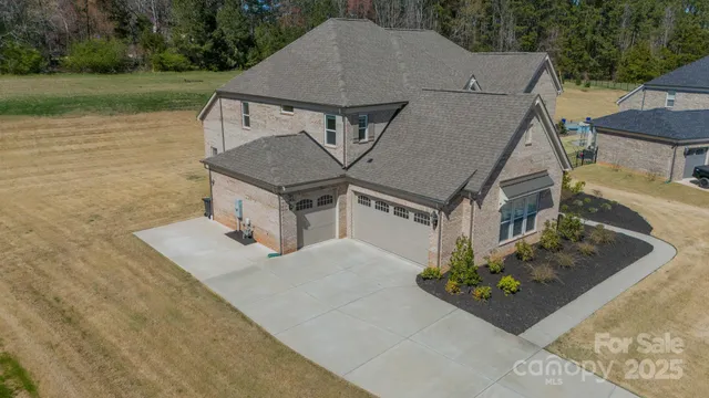 an aerial view of a balcony with chairs