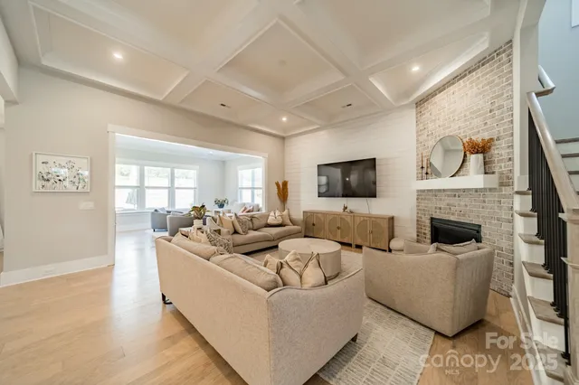 a living room with fireplace furniture and a flat screen tv