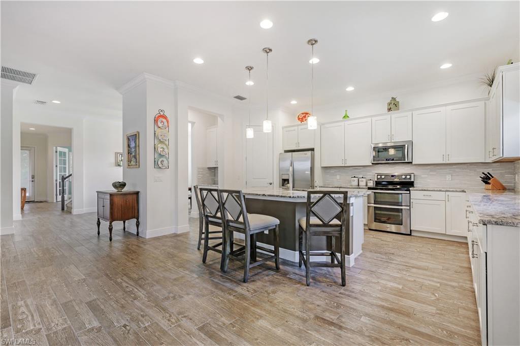 4064 Raffia Drive Naples, FL 34119 - Photo 33 of 33 Open Floor Plan View From Kitchen to Entry Doorway
