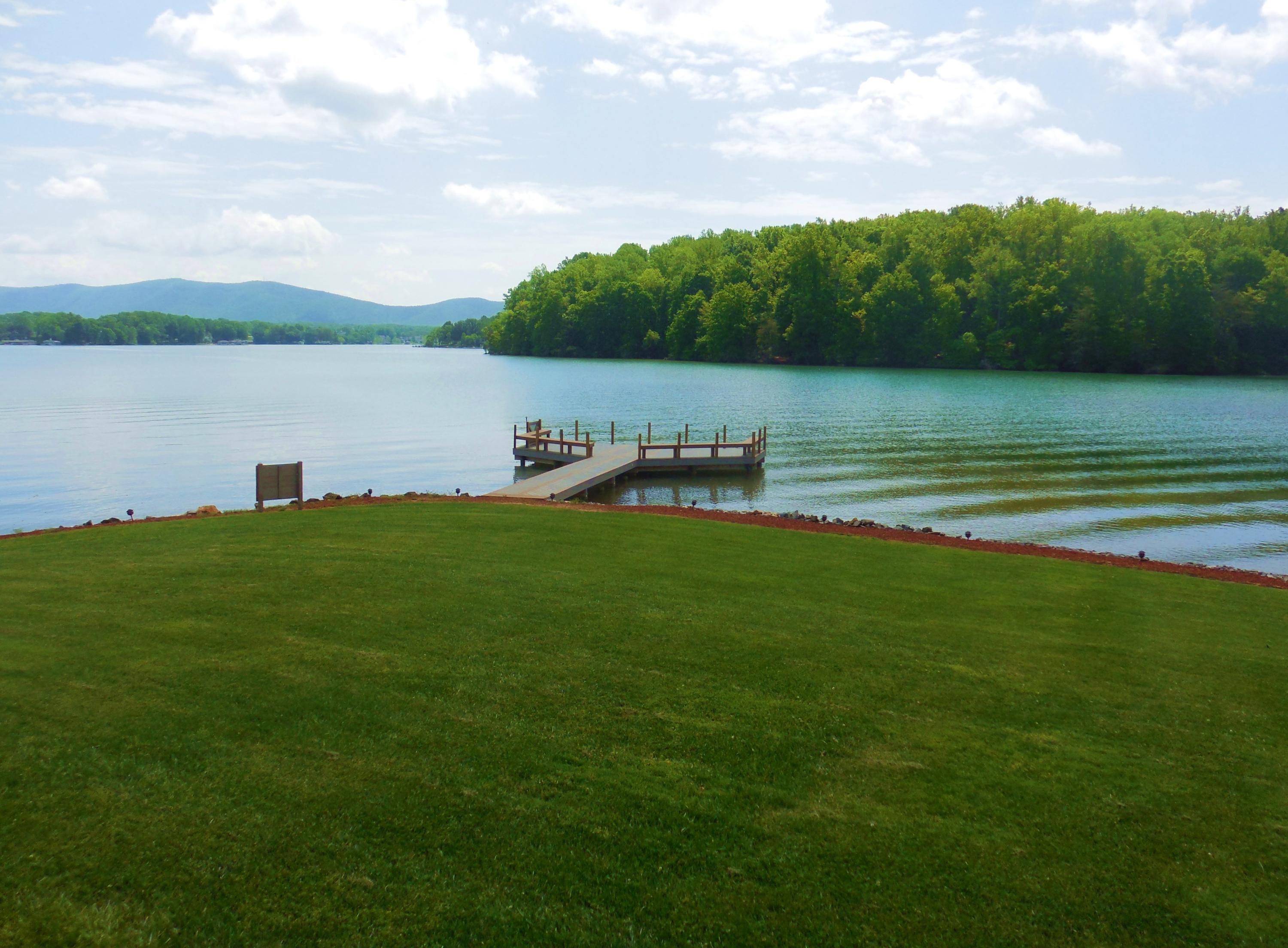 610 Monte Vista Road, Unit 705 Union Hall, VA 24176 - Photo 23 of 74 a view of a lake with houses in the back