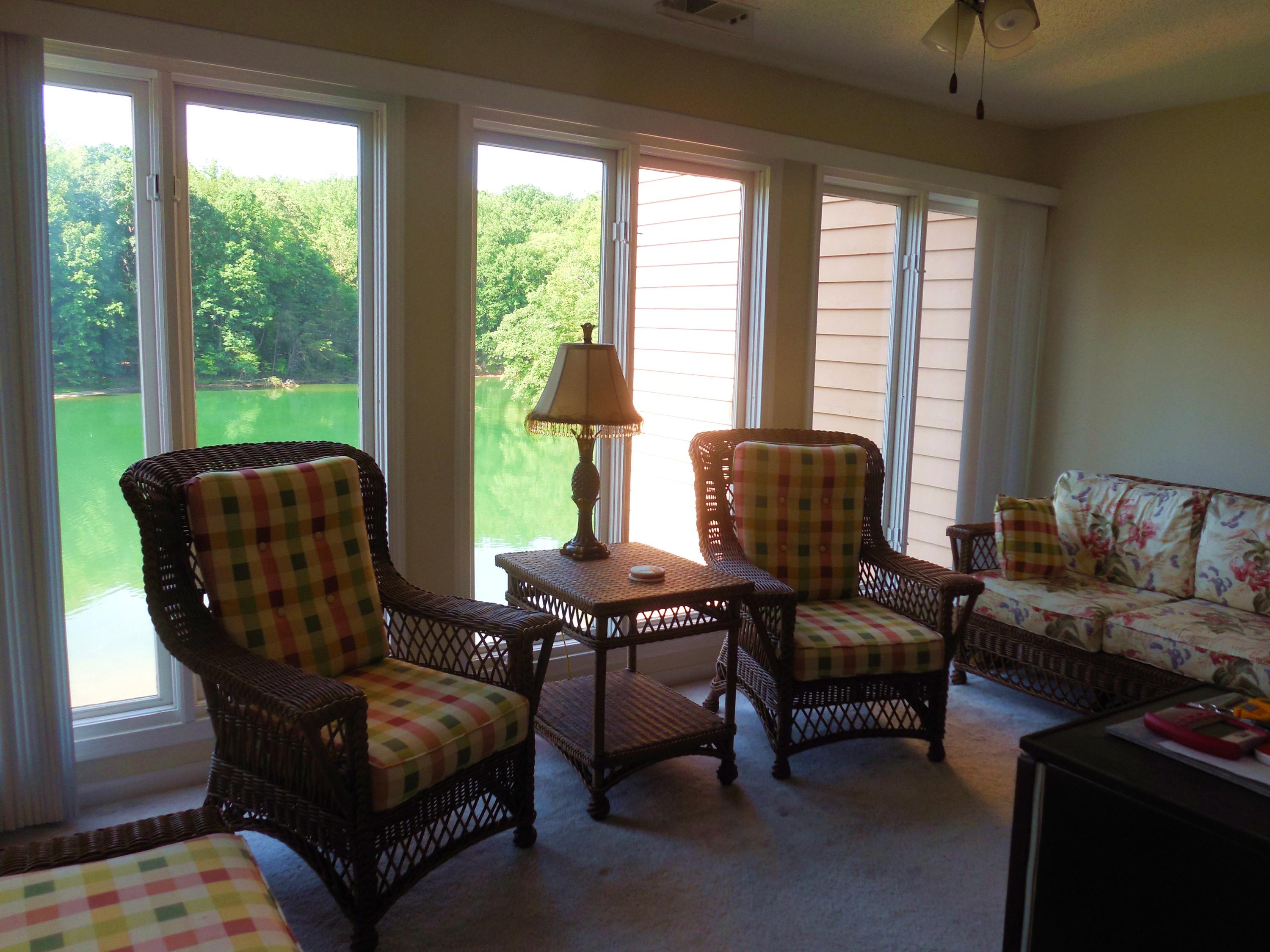 610 Monte Vista Road, Unit 705 Union Hall, VA 24176 - Photo 26 of 74 a living room with furniture and a floor to ceiling window