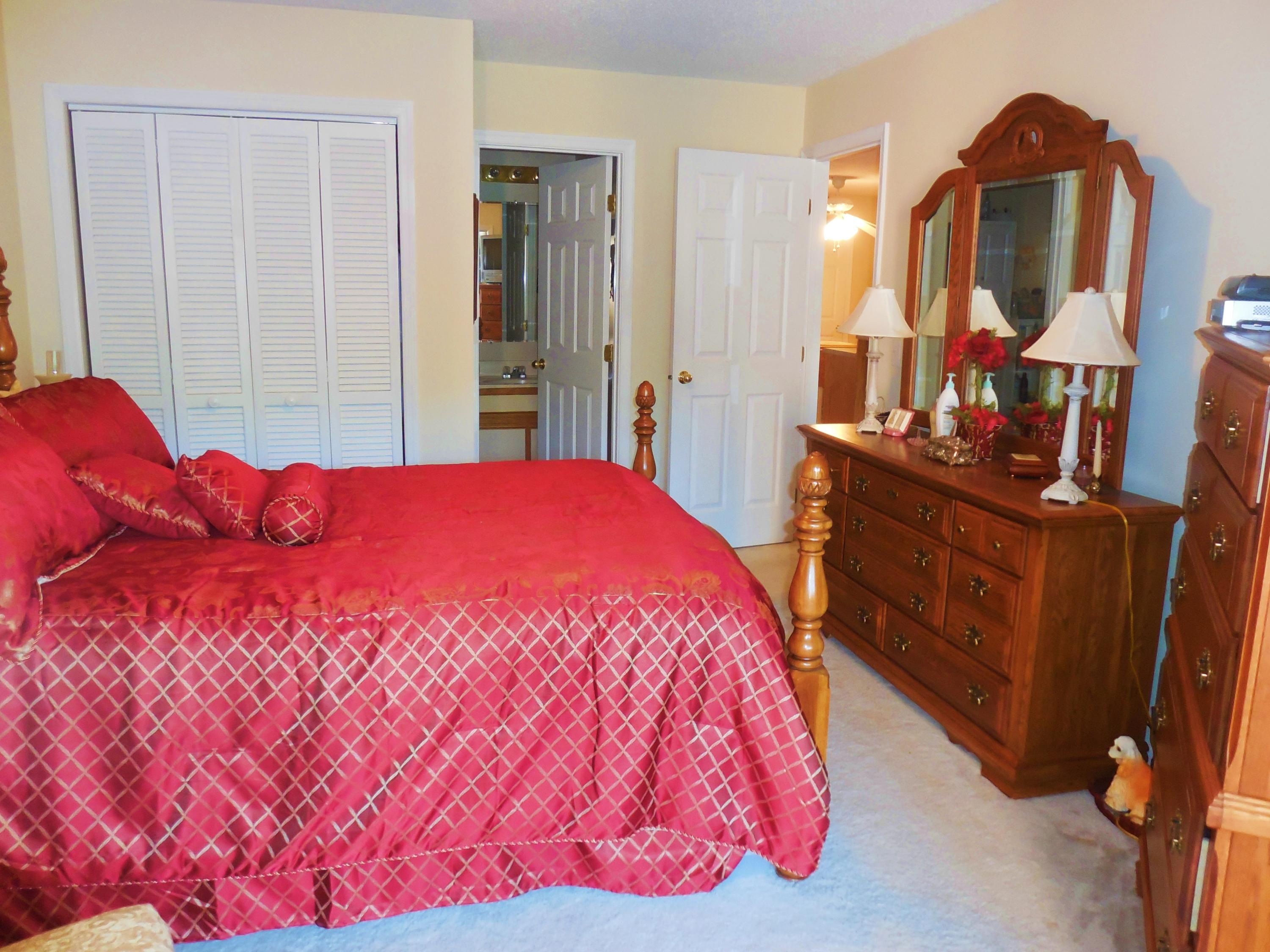 610 Monte Vista Road, Unit 705 Union Hall, VA 24176 - Photo 30 of 74 a bedroom with a bed and a mirror