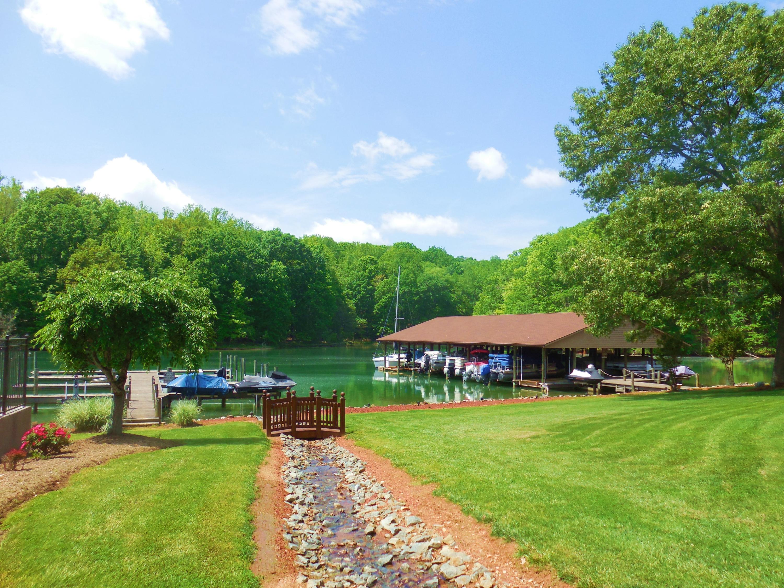610 Monte Vista Road, Unit 705 Union Hall, VA 24176 - Photo 50 of 74 a view of a garden with lawn chairs under an umbrella