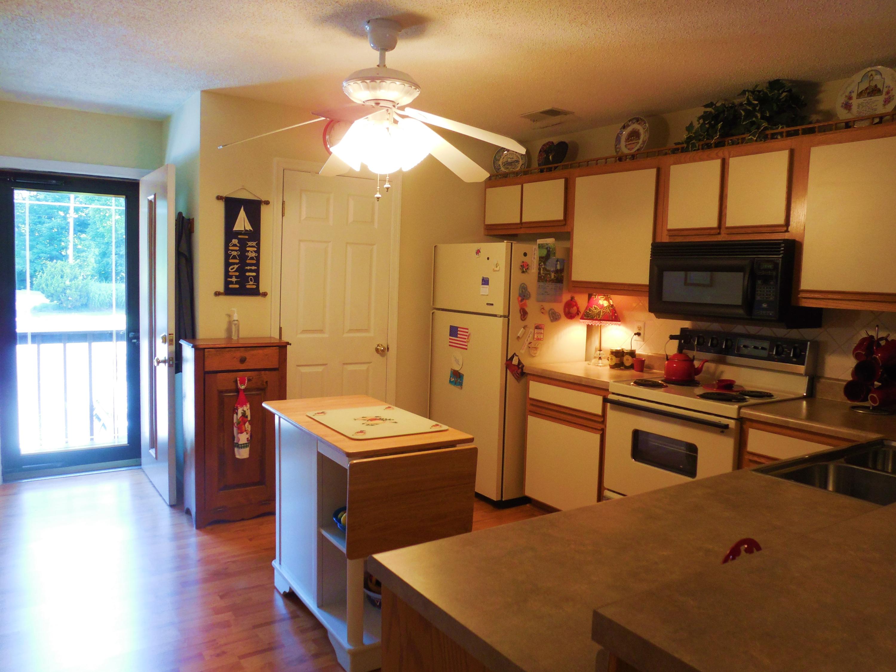 610 Monte Vista Road, Unit 705 Union Hall, VA 24176 - Photo 6 of 74 a kitchen that has a lot of cabinets a sink and a stove in it