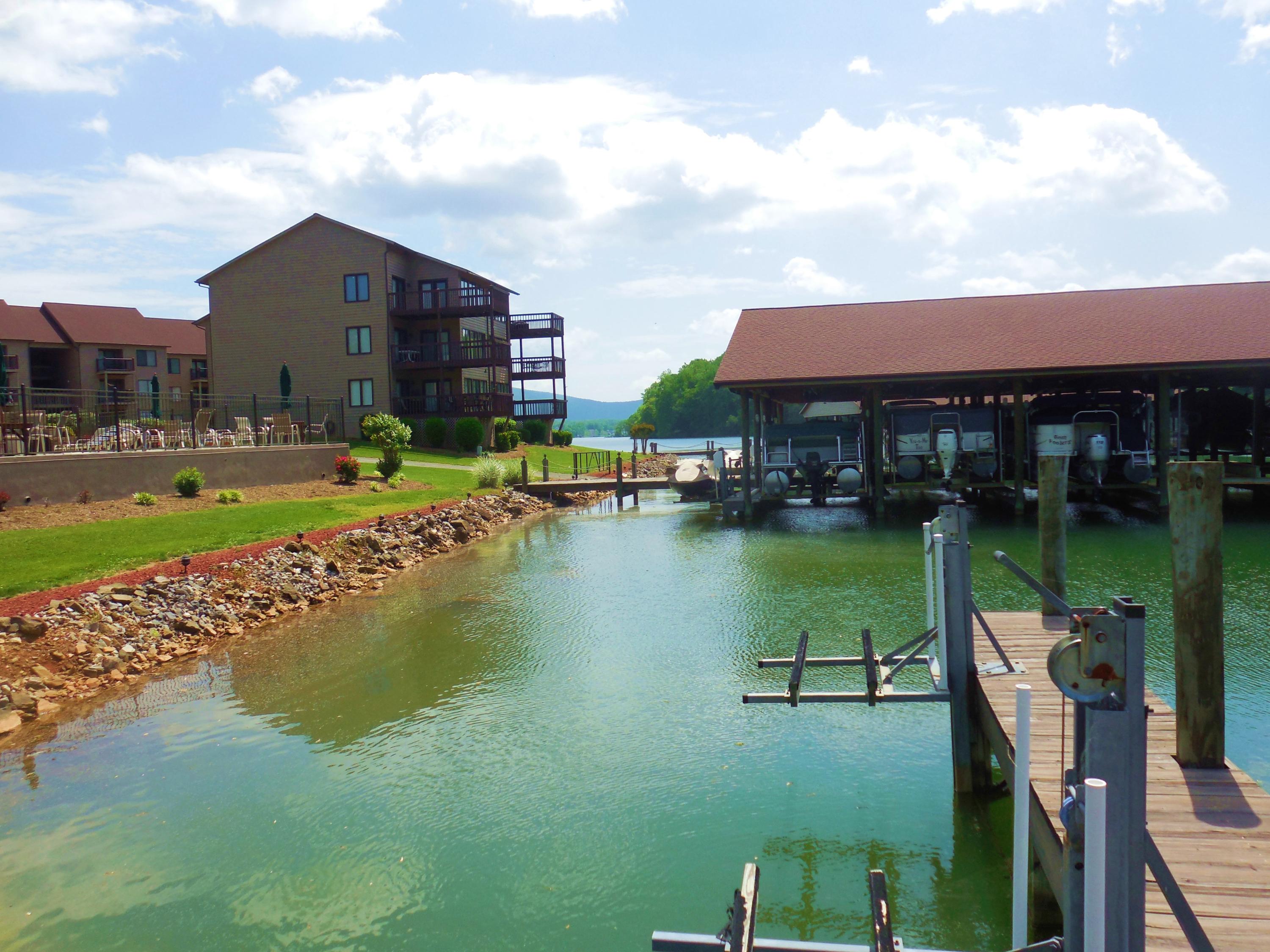 610 Monte Vista Road, Unit 705 Union Hall, VA 24176 - Photo 56 of 74 a view of a lake with a yard and large trees