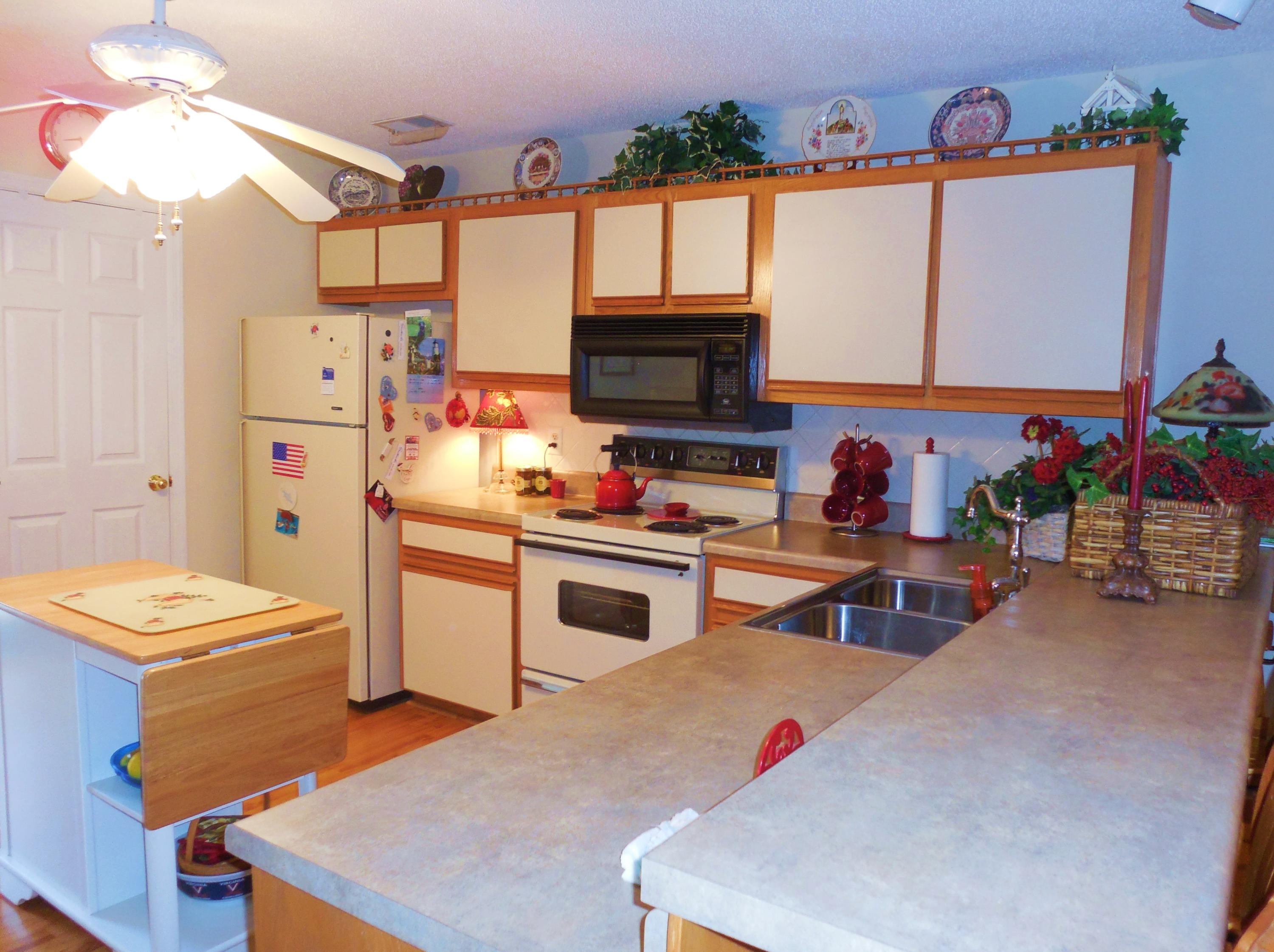 610 Monte Vista Road, Unit 705 Union Hall, VA 24176 - Photo 7 of 74 a kitchen with stainless steel appliances kitchen island granite countertop a stove and a refrigerator