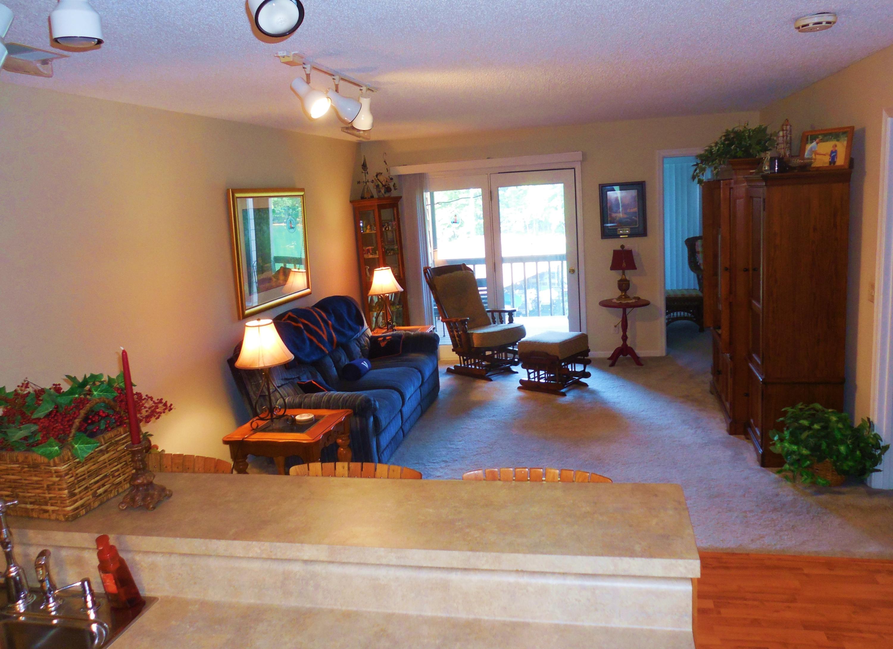 610 Monte Vista Road, Unit 705 Union Hall, VA 24176 - Photo 10 of 74 a living room with furniture gym equipment and a large window