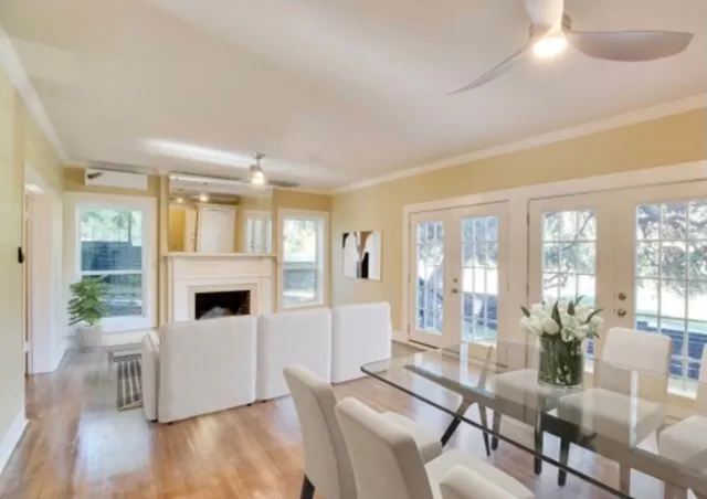 a living room with furniture and a kitchen