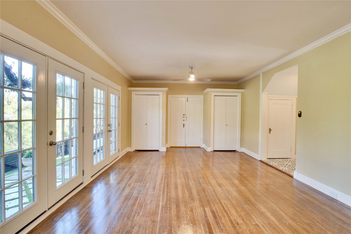 1115 Enfield Road, Unit B Austin, TX 78703 - Photo 16 of 34 a view of an empty room with wooden floor and a window
