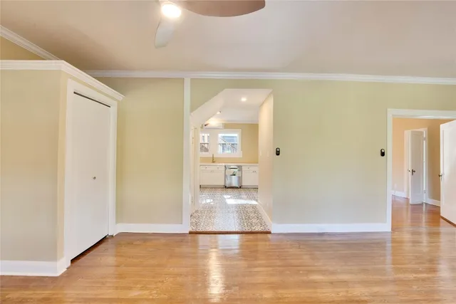 a view of an empty room and wooden floor