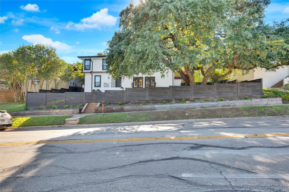 1115 Enfield Road, Unit B Austin, TX 78703 - Photo 2 of 34 a front view of a house with a yard
