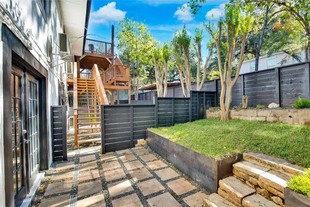 a backyard of a house with lots of green space