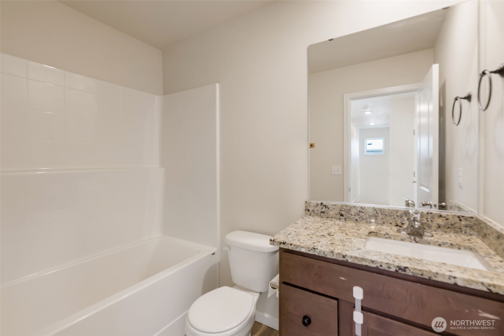 31723 120th Street Southeast Sultan, WA 98294 - Photo 18 of 27 a bathroom with a granite countertop sink a toilet and bathtub