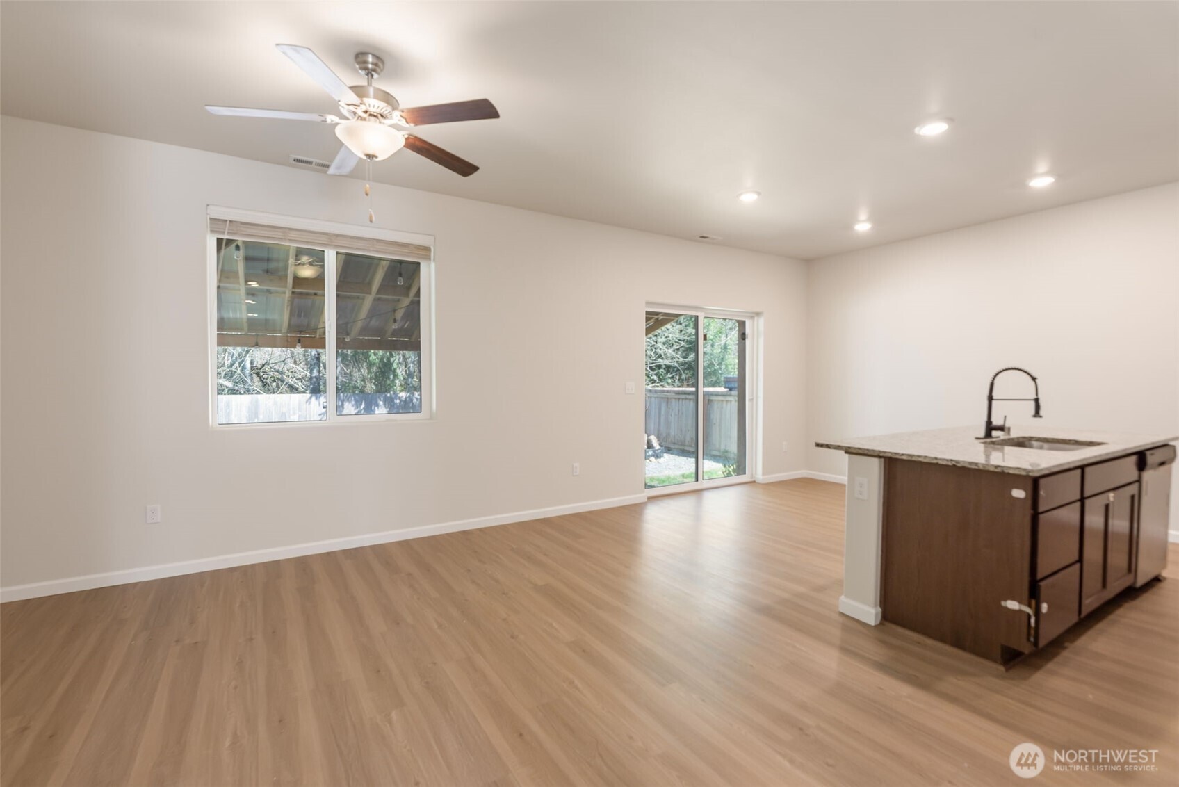 31723 120th Street Southeast Sultan, WA 98294 - Photo 3 of 27 a view of an empty room with a window and wooden floor