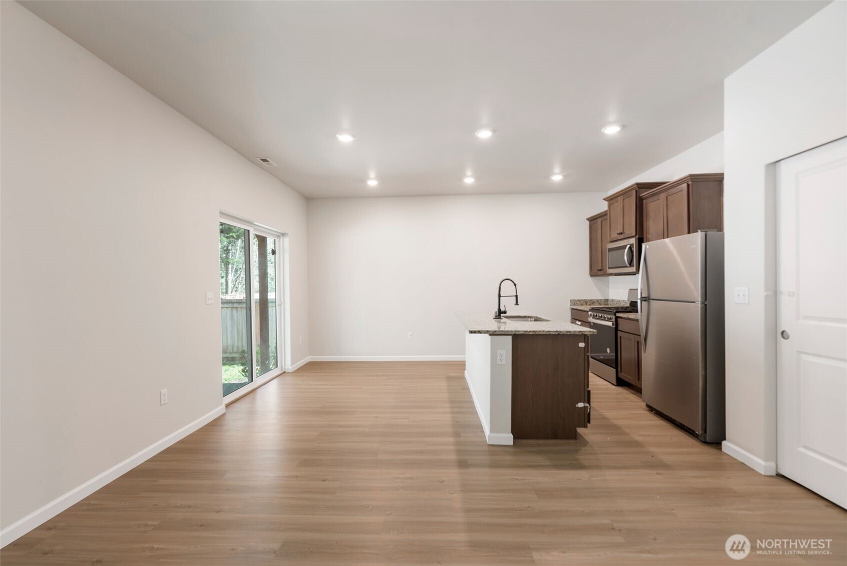 31723 120th Street Southeast Sultan, WA 98294 - Photo 5 of 27 a view of a kitchen with a sink and refrigerator