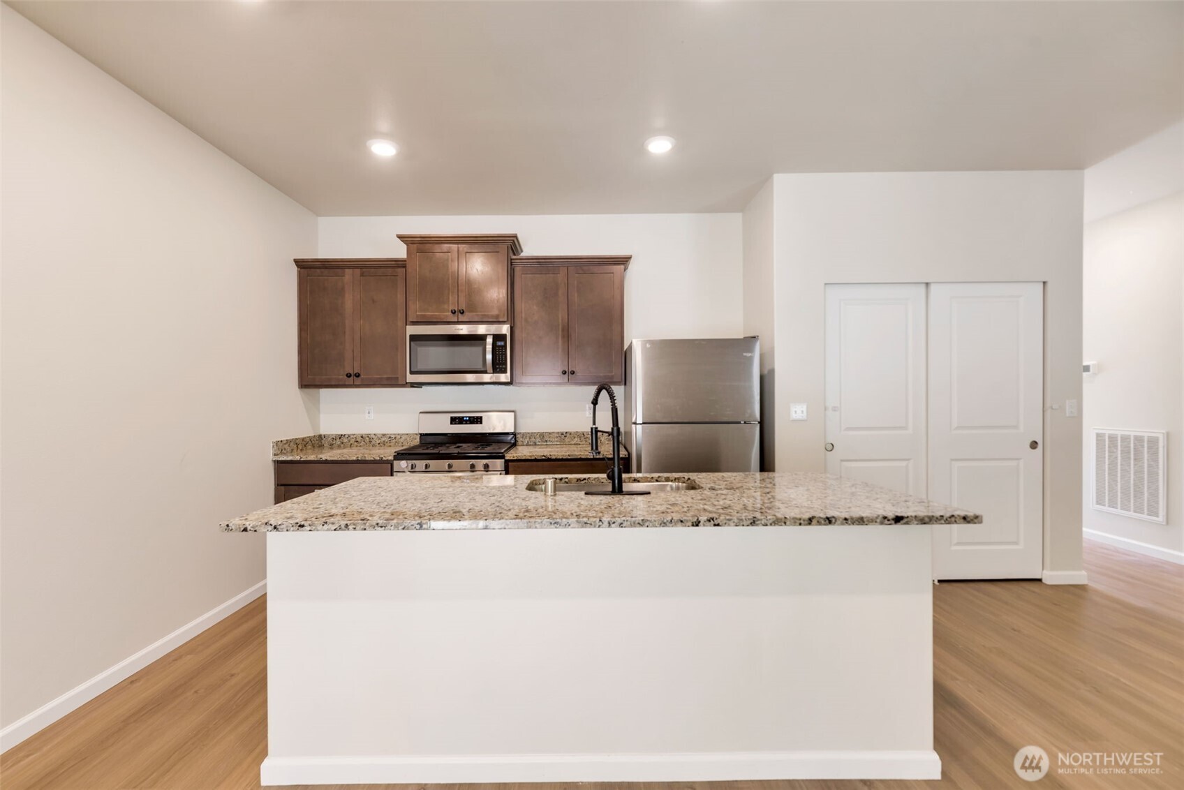 31723 120th Street Southeast Sultan, WA 98294 - Photo 6 of 27 a kitchen with stainless steel appliances granite countertop a sink and a microwave
