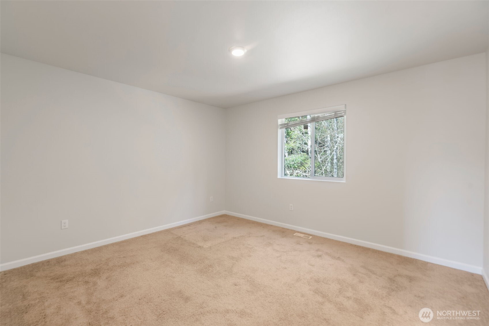 31723 120th Street Southeast Sultan, WA 98294 - Photo 9 of 27 an empty room with windows