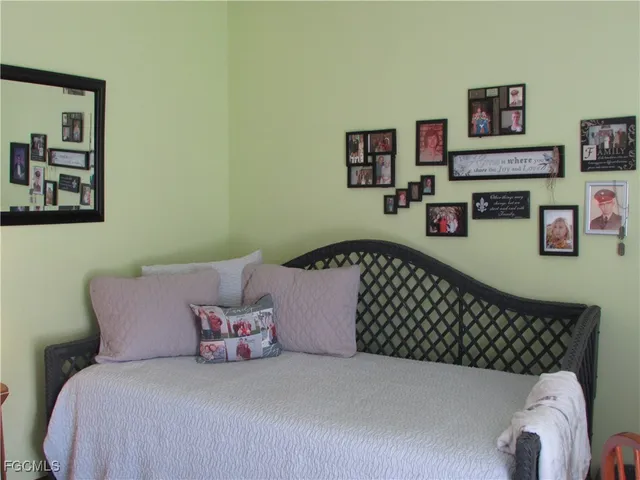 a bedroom with a bed and dresser