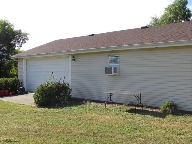 a backyard of a house with seating space