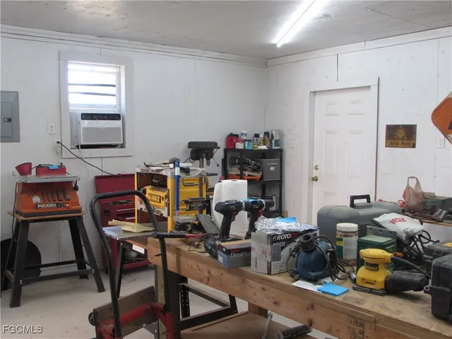 a work room with furniture and a window