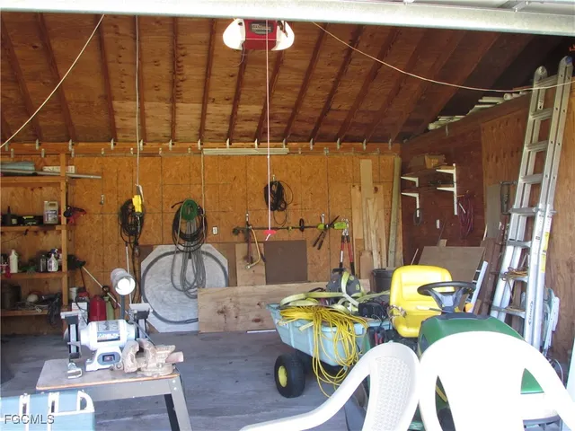 a view of a dining room with furniture one side kitchen view