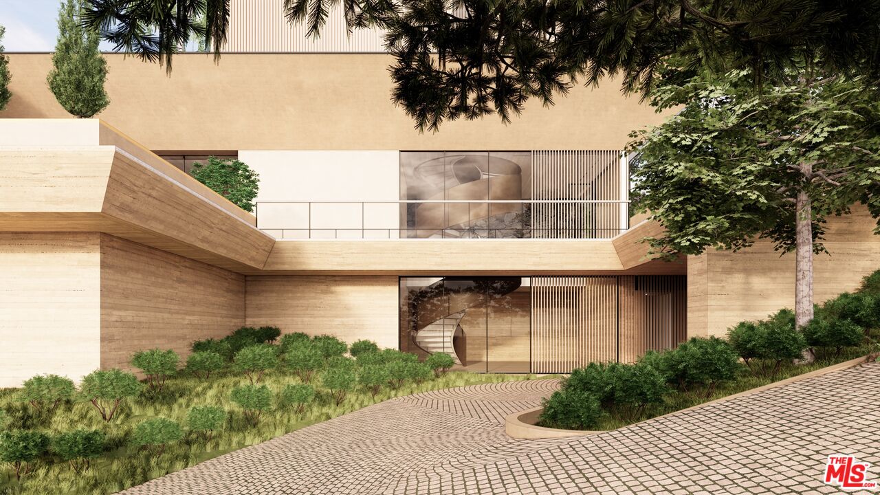 1001 Bel Air Road Los Angeles, CA 90077 - Photo 2 of 22 a front view of a house with a garden