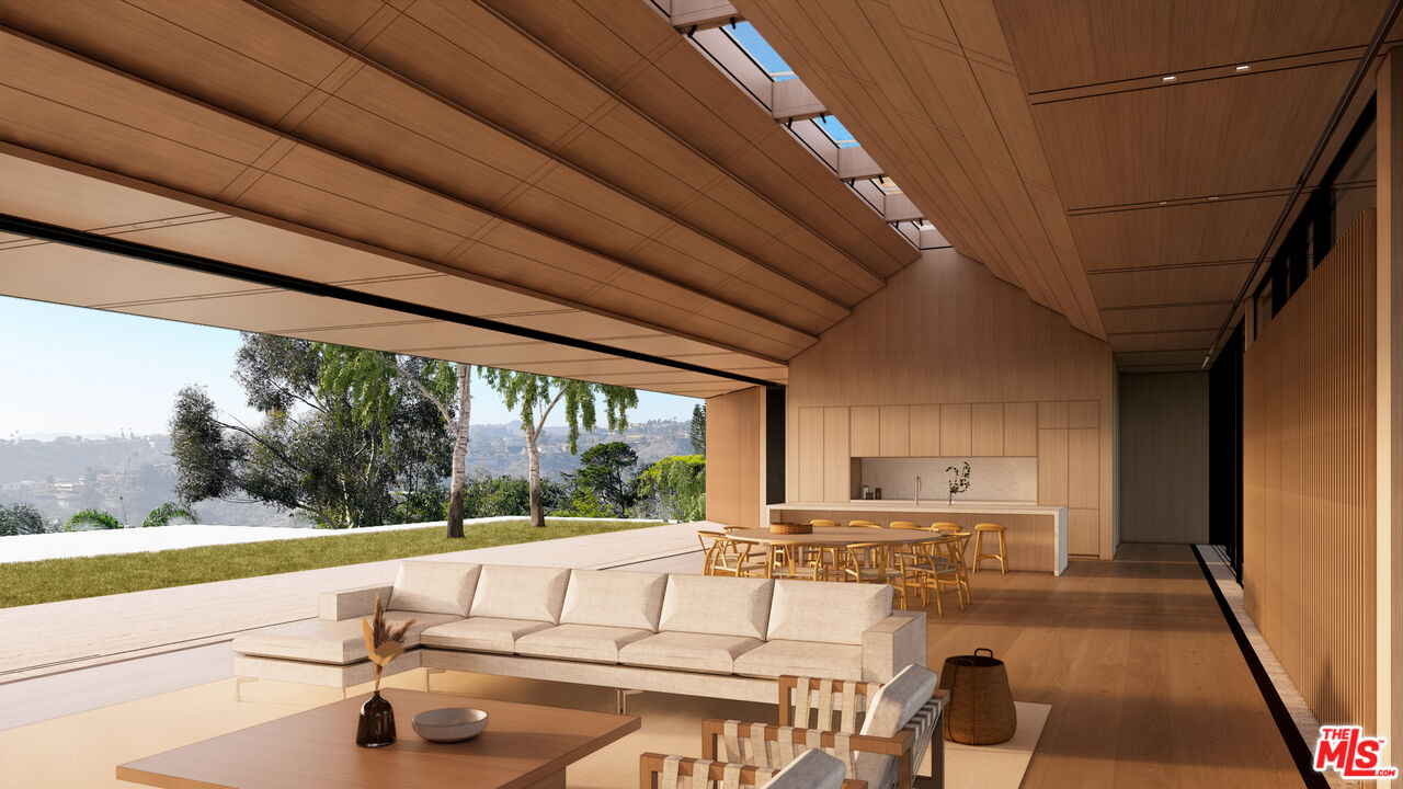 1001 Bel Air Road Los Angeles, CA 90077 - Photo 5 of 22 a living room with a large window and a table