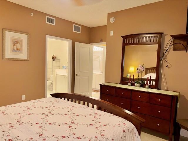 5880 West Sample Road, Unit 105 Coral Springs, FL 33067 - Photo 13 of 23 a bedroom with a bed and a dresser in it