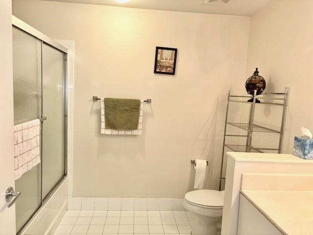 5880 West Sample Road, Unit 105 Coral Springs, FL 33067 - Photo 16 of 23 a bathroom with a toilet and a shower