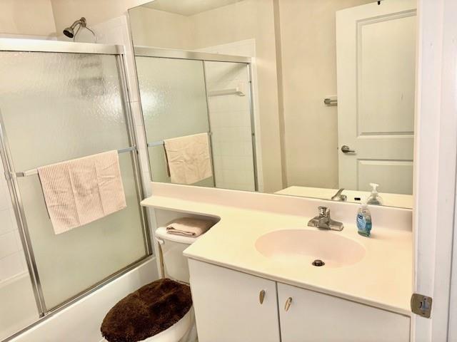 5880 West Sample Road, Unit 105 Coral Springs, FL 33067 - Photo 17 of 23 a bathroom with a sink and a mirror
