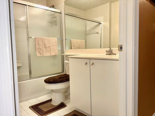 5880 West Sample Road, Unit 105 Coral Springs, FL 33067 - Photo 18 of 23 a bathroom with a granite countertop toilet and a sink